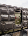 Jeep tailgate with a cargo cover in a desert setting