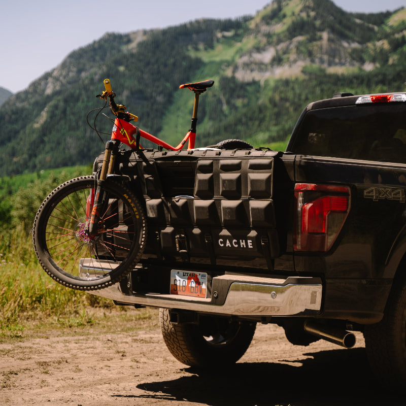 Ford F-150 with Cache locking tailgate pad holding mountain bikes