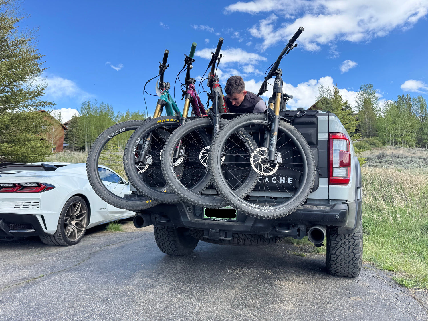 4 bikes on a Cache tailgate Pad on a Ford Raptor