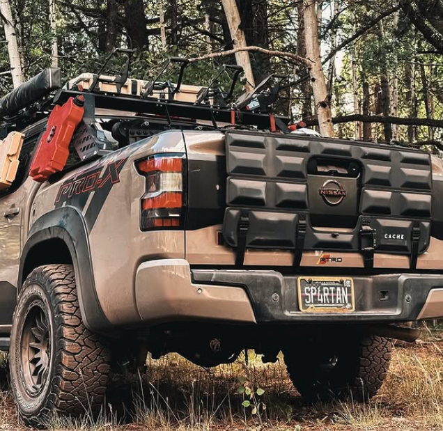 Nissan truck with off-road equipment in a forest setting