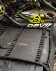 Pickup truck with padded tailgate and mountain bikes parked on a dirt road